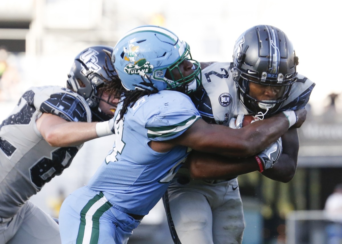 Oct 24, 2020; Tulane Green Wave linebacker Dorian Williams (24) tackles UCF Knights running back Otis Anderson. Mandatory Credit: Reinhold Matay-USA TODAY