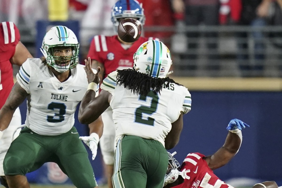 Sep 18, 2021; Tulane Green Wave linebacker Dorian Williams (2) recovers a fumble against the Mississippi Rebels. Mandatory Credit: Marvin Gentry-USA TODAY Sports