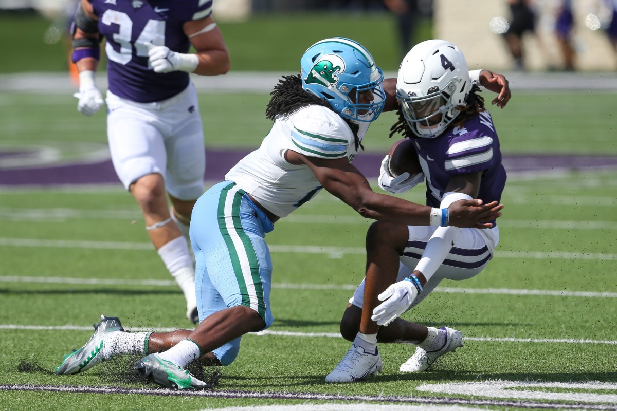 Sep 17, 2022; Kansas State Wildcats wide receiver Malik Knowles (4) is tackled by Tulane Green Wave linebacker Dorian Williams (2). Mandatory Credit: Scott Sewell-USA TODAY Sports