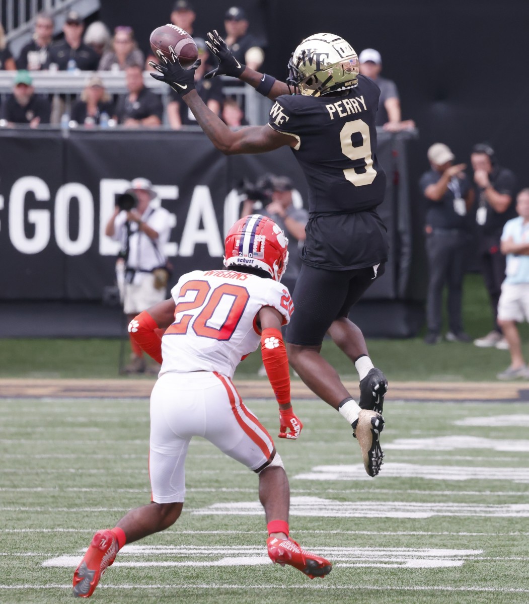 Wake Forest Demon Deacons receiver A.T. Perry (9) catches a pass in front of Clemson Tigers cornerback Nate Wiggins (20). Mandatory Credit: Reinhold Matay-USA TODAY Sports