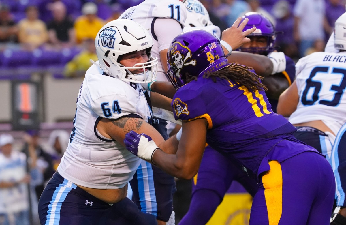 Old Dominion Monarchs offensive lineman Nick Saldiveri (64) blocks East Carolina Pirates linebacker Jeremy Lewis (11). Mandatory Credit: James Guillory-USA TODAY Sports