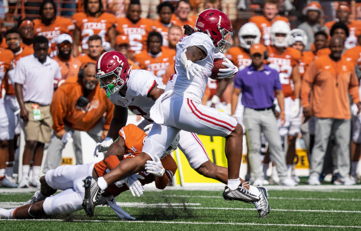 Sep 10, 2022; Austin, TX, USA; Texas defensive back Anthony Cook (11) attempts to tackle Alabama running back Jahmyr Gibbs (1) as Gibbs carries the ball during the first half of the Longhorns game against the Crimson Tide at Royal-Memorial Stadium in Austin on Saturday, Sept. 10, 2022. Mandatory Credit: Sara Diggins/Austin American-Statesman-USA TODAY NETWORK