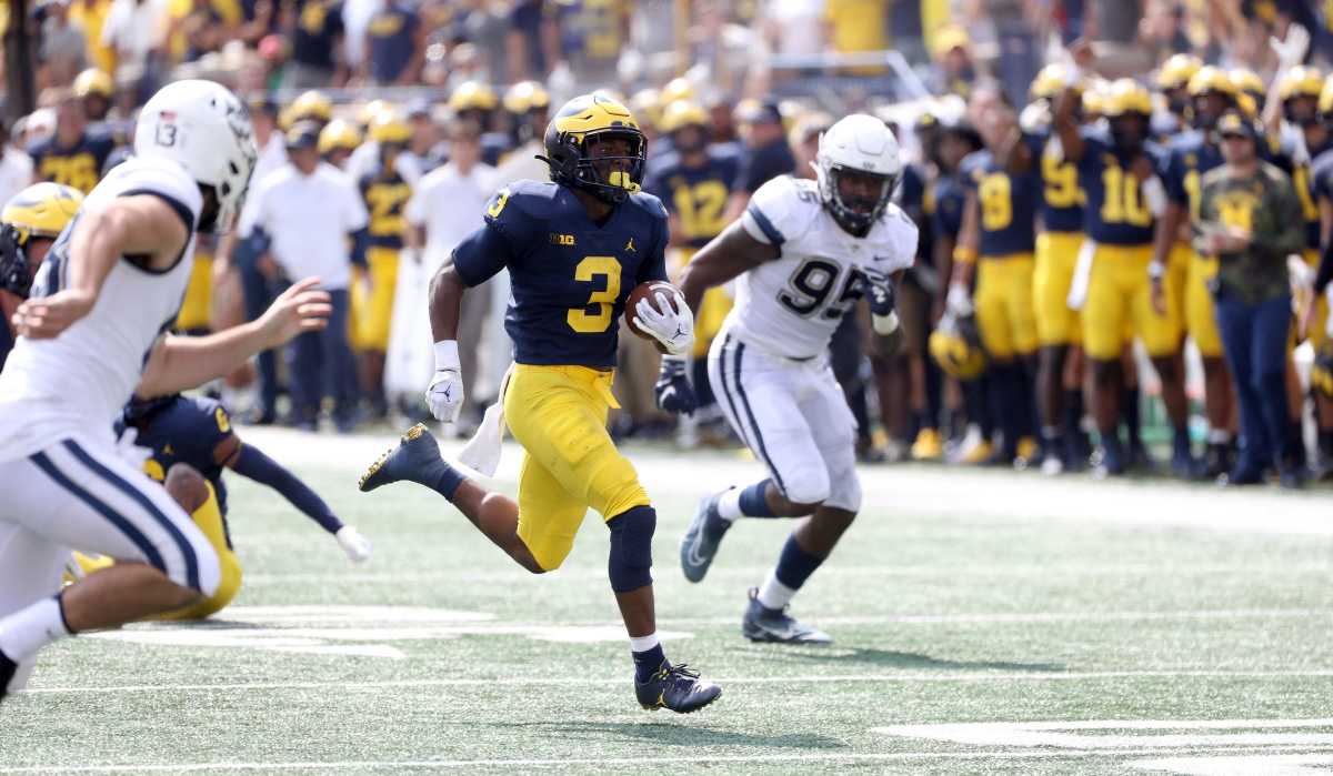 Michigan Wolverines wide receiver A.J. Henning runs back a punt for a touchdown against the Connecticut Huskies during the first half at Michigan Stadium, Saturday, September 17, 2022. Mich Conn