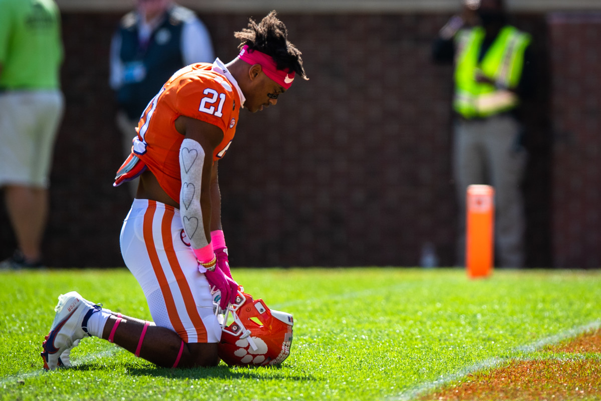 Oct 24, 2020; Clemson, South Carolina, USA; Clemson cornerback Malcolm Greene (21) kneels before their game against Syracuse at Memorial Stadium. Mandatory Credit: Ken Ruinard-USA TODAY Sports