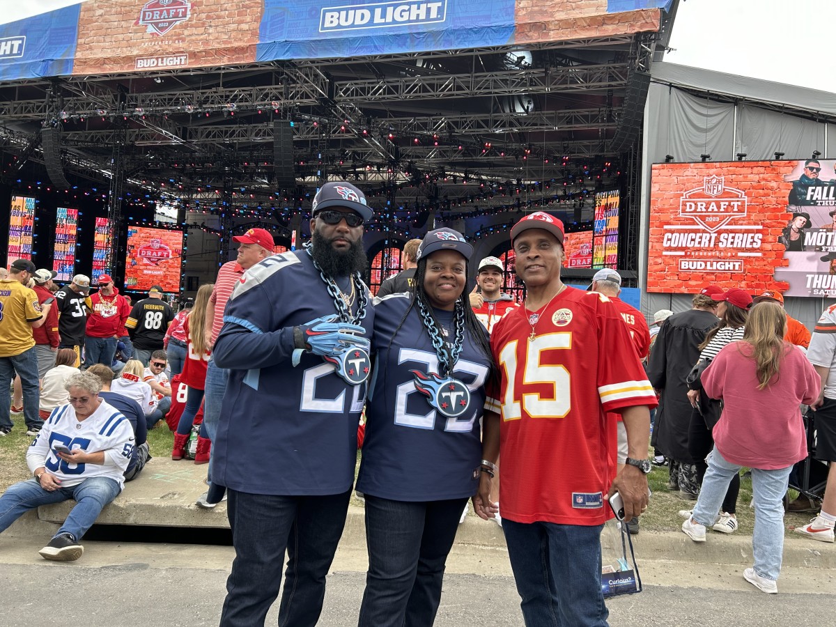 The Dunbars with their uncle, Johnny McClendon, who's a Chiefs fan living in Kansas City. (AllTitans.com photo by Tom Brew)