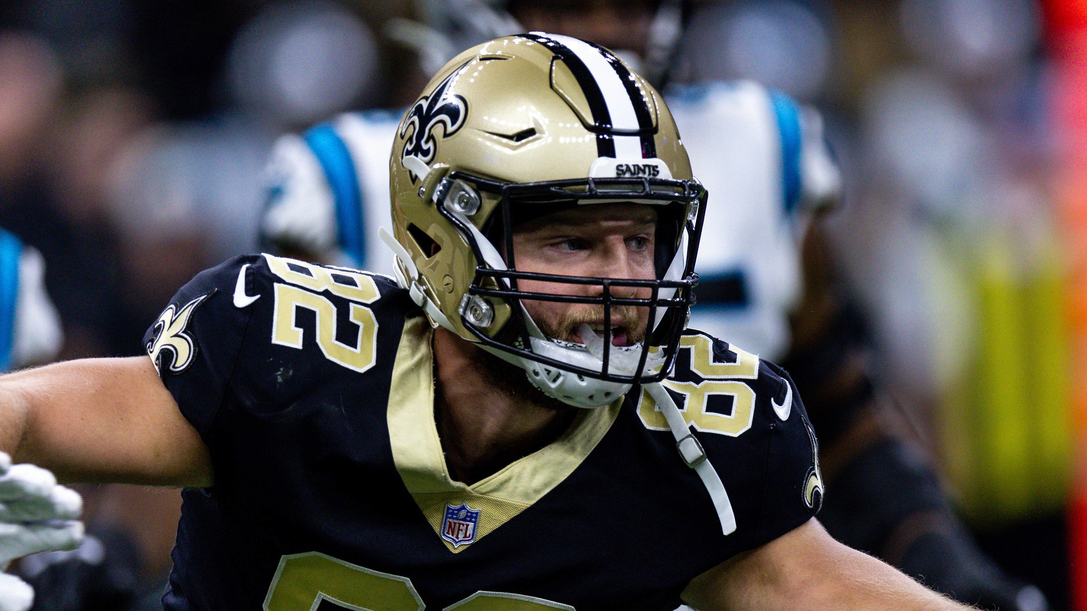 New Orleans Saints tight end Adam Trautman (82) wears a Salute to Service  towel during an NFL football game against the Los Angeles Rams, Sunday,  Nov. 20, 2022, in New Orleans. (AP