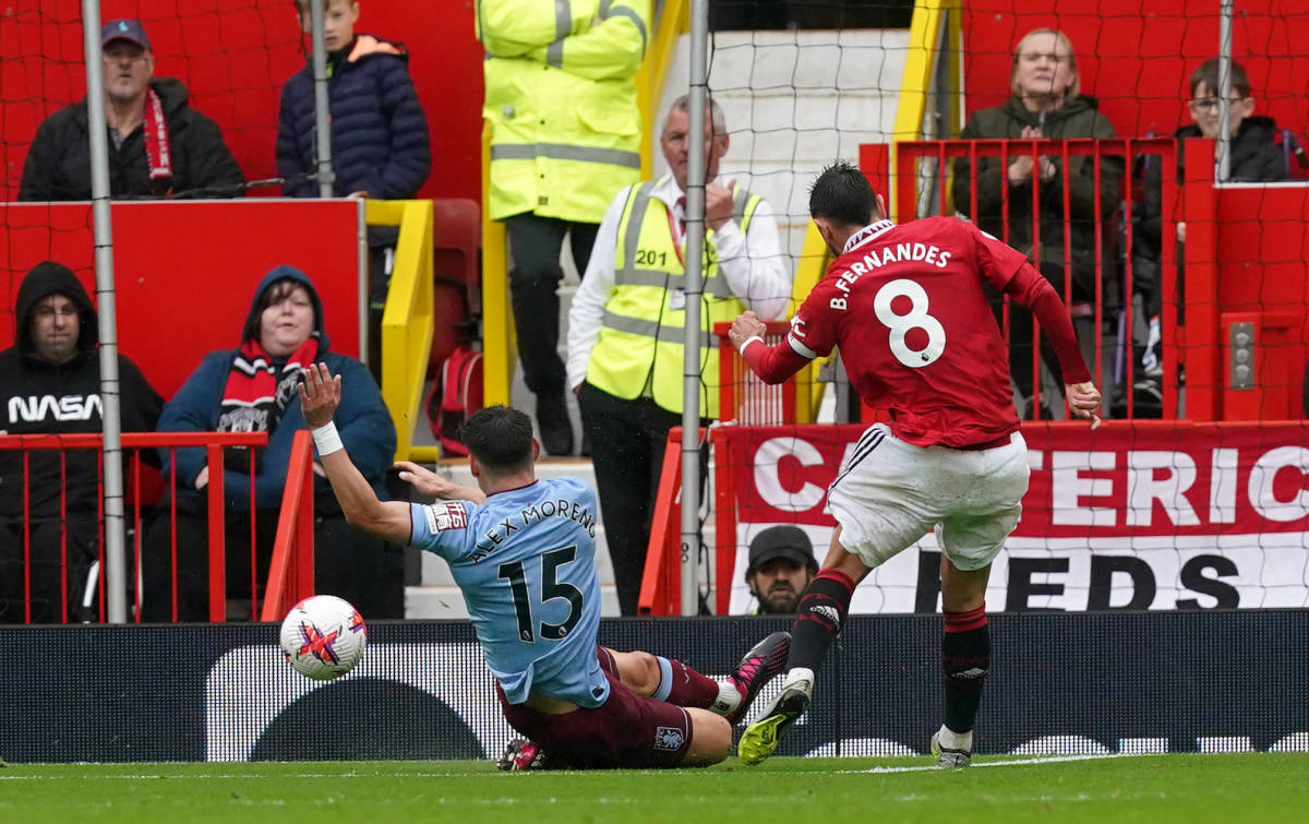 Bruno Fernandes pictured (right) scoring for Manchester United against Aston Villa in April 2023