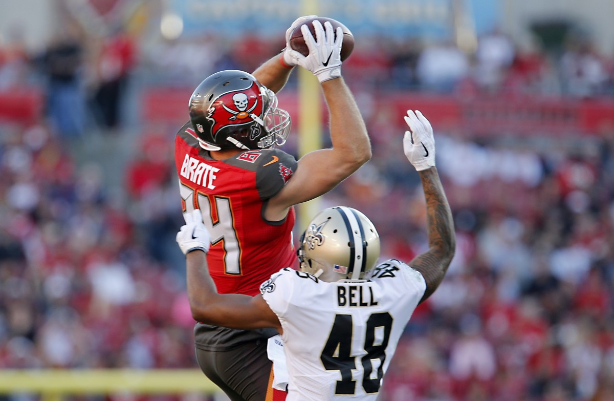 Dec 31, 2017; Tampa Bay Buccaneers tight end Cameron Brate (84) goes up for a catch over New Orleans Saints safety Vonn Bell (48). Mandatory Credit: Reinhold Matay-USA TODAY