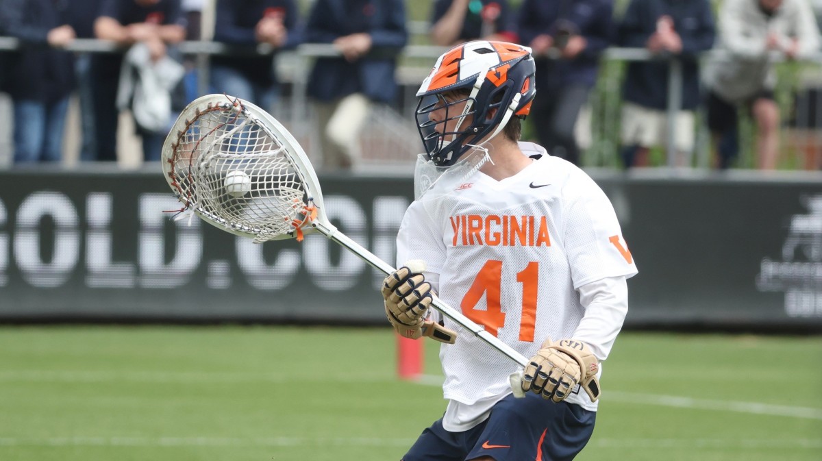 Matthew Nunes looks to clear the ball during the Virginia men's lacrosse game against Syracuse at Klockner Stadium.