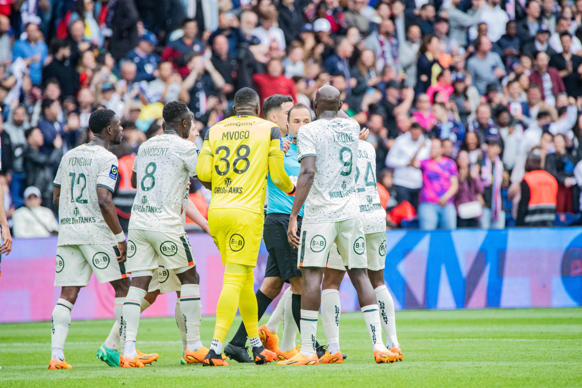Lorient keeper Yvon Mvogo and his teammates pictured complaining to referee Jerome Brisard after Kylian Mbappe (not in shot) scored a controversial goal for PSG during a game in April 2023