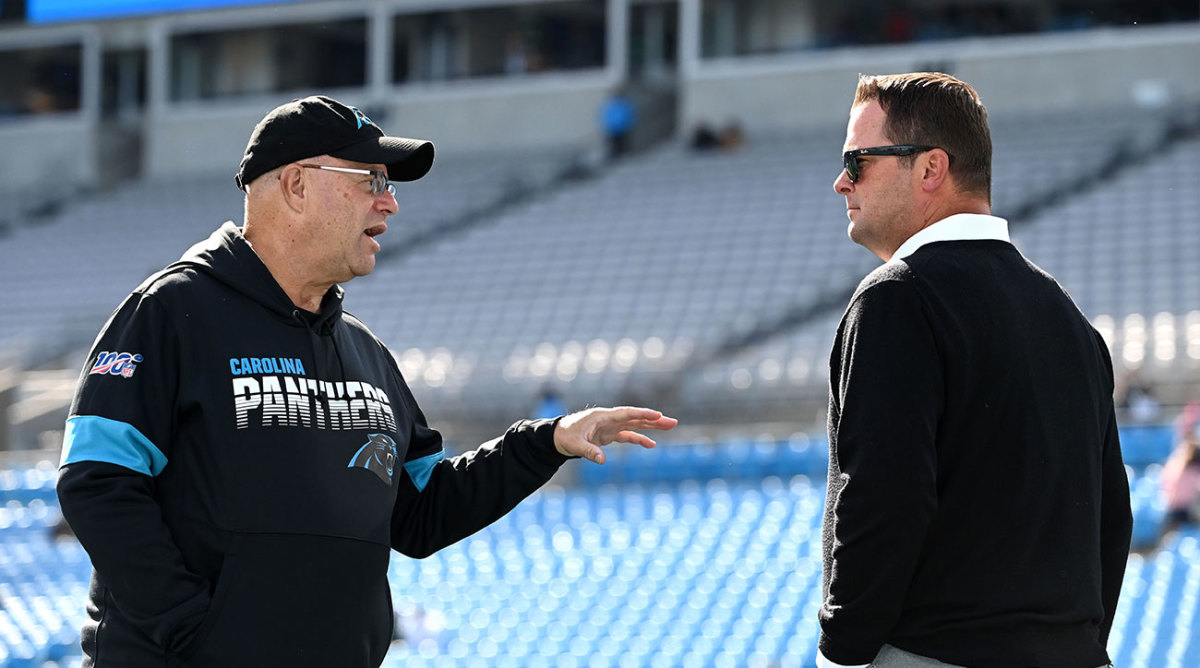David Tepper talks to Scott Fitterer on the field before a Panthers game.
