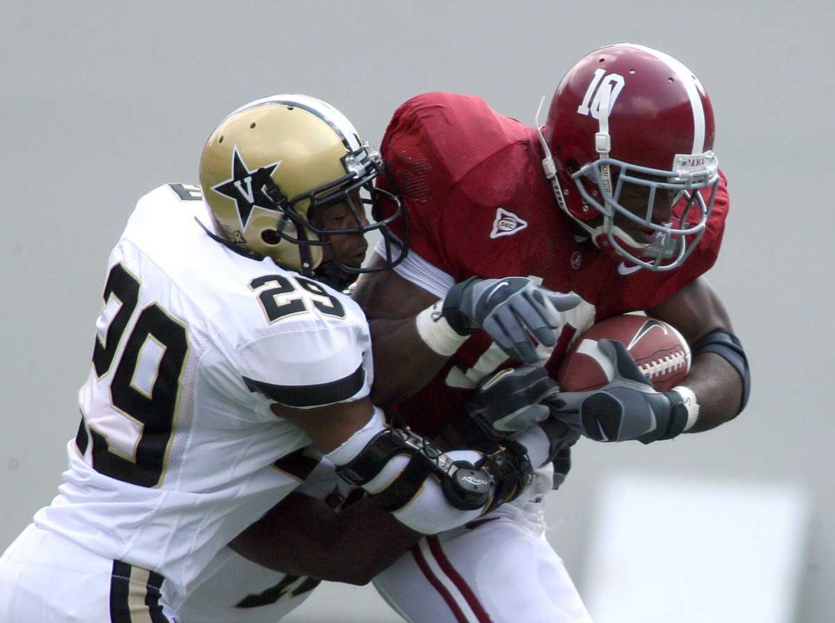 Alabama's Jimmy Johns (10) is tackled by Vanderbilt's Joel Caldwell (29) during a 2006 game at Bryant-Denny Stadium.