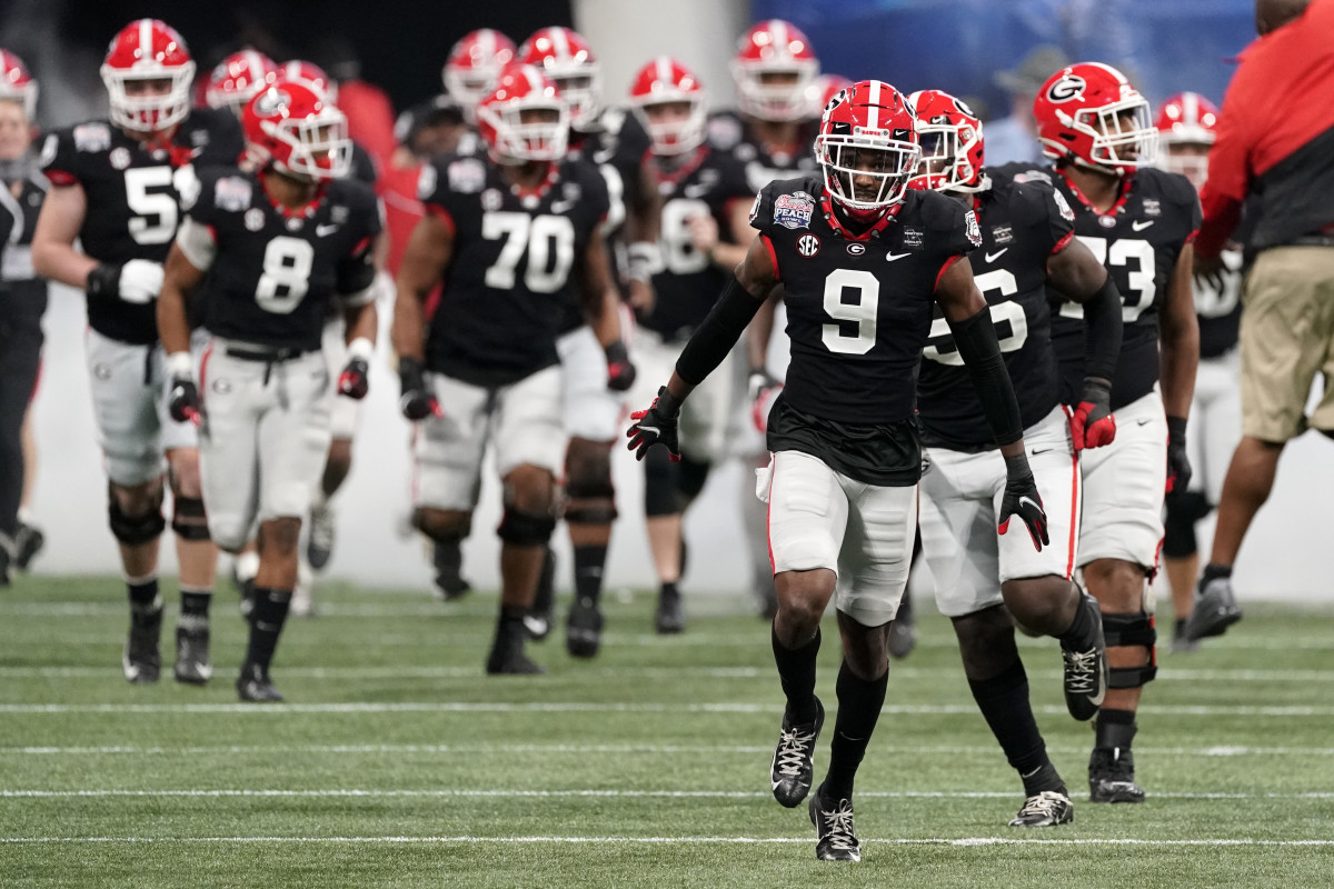 Ameer Speed #9 of the Georgia Bulldogs leads his team out on the field during the 2020 Chick-fil-A Peach Bowl NCAA football game between the Georgia Bulldogs and Cincinnati Bearcats, Jan. 1, 2021, in Atlanta. (Paul Abell via Abell Images for the Chick-fil-A Peach Bowl)