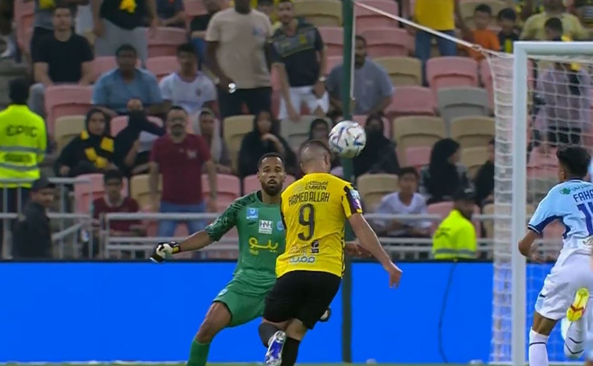 Abderrazak Hamdallah pictured heading the ball to score a remarkable goal from 30 yards during Al-Ittihad's 4-0 win over Abha in May 2023