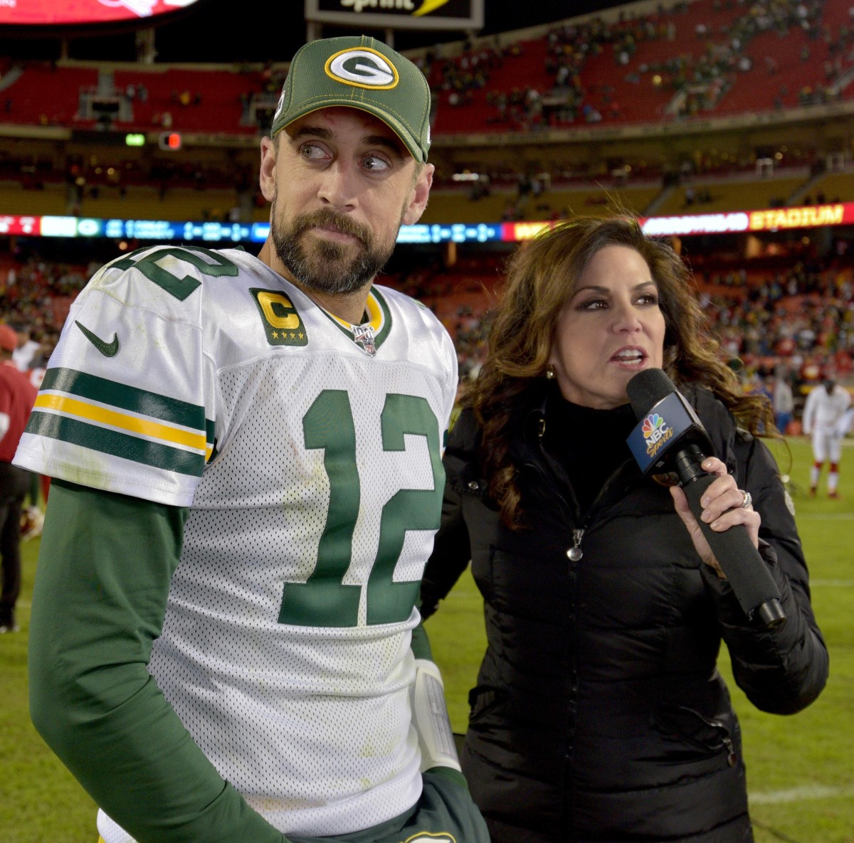 Cal alumni Aaron Rodgers and Michele Tafoya. Photo by Denny Medley, USA TODAY Sports