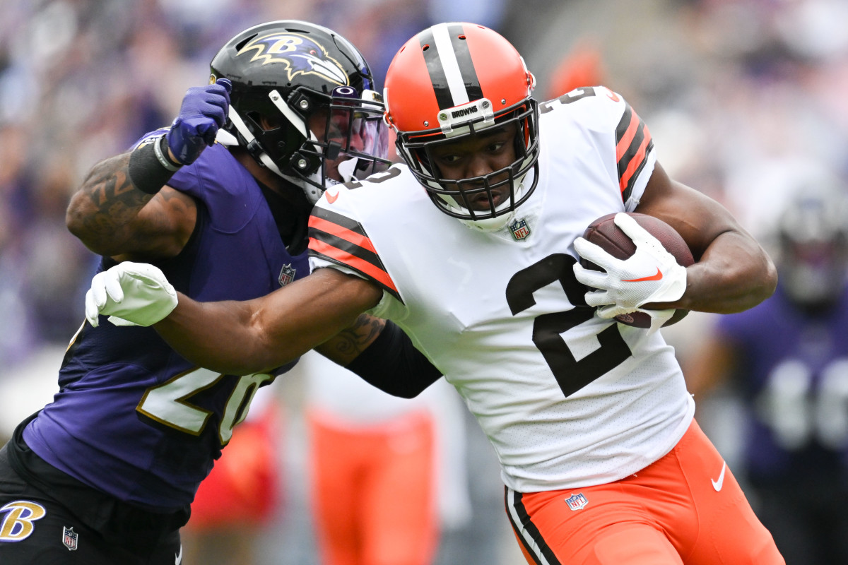 Cleveland Browns wide receiver Amari Cooper (2) runs as Baltimore Ravens safety Geno Stone (26) attempts to tackle during the first half at M&T Bank Stadium in 2022