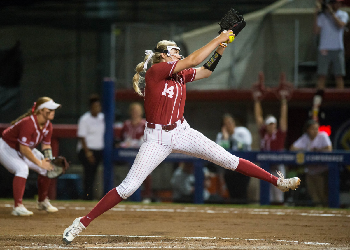 May 11, 2023; Fayetteville, AK, USA; Alabama Crimson Tide pitcher Montana Fouts (14) delivers a pitch during a quarterfinal game against the Arkansas Razorbacks in the SEC Softball Tournament.