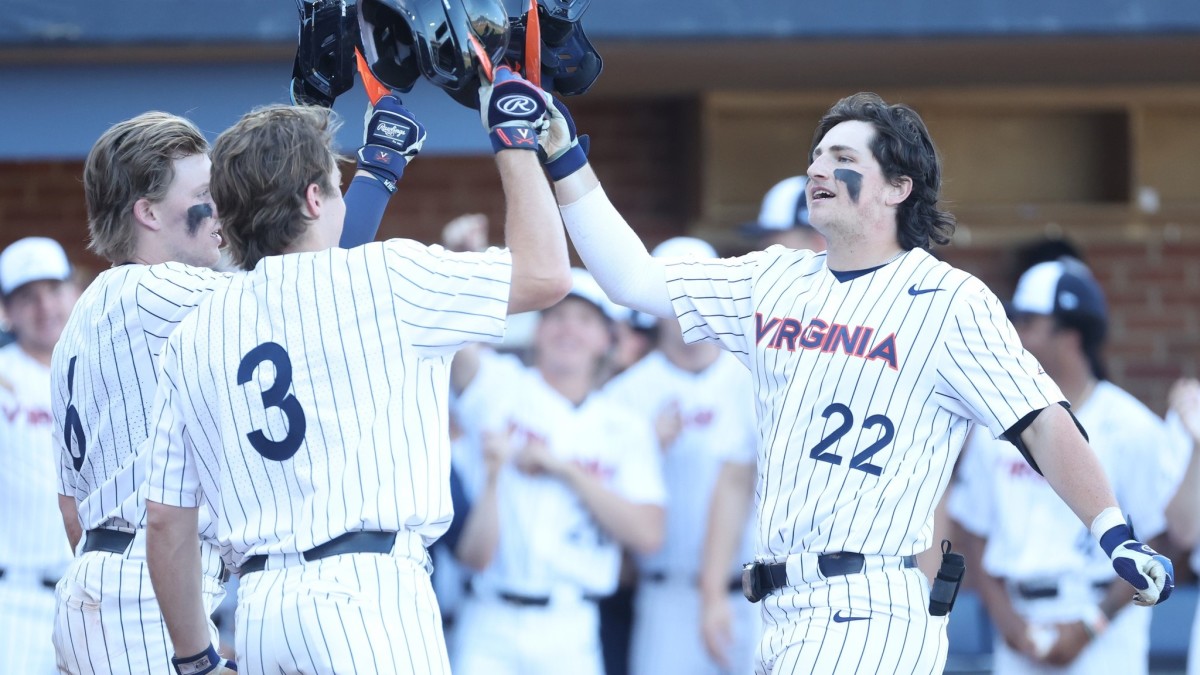 Jake Gelof celebrates at home plate with Griff O'Ferrall and Kyle Teel after hitting a home run during the Virginia baseball game against Mount St. Mary's at Disharoon Park.