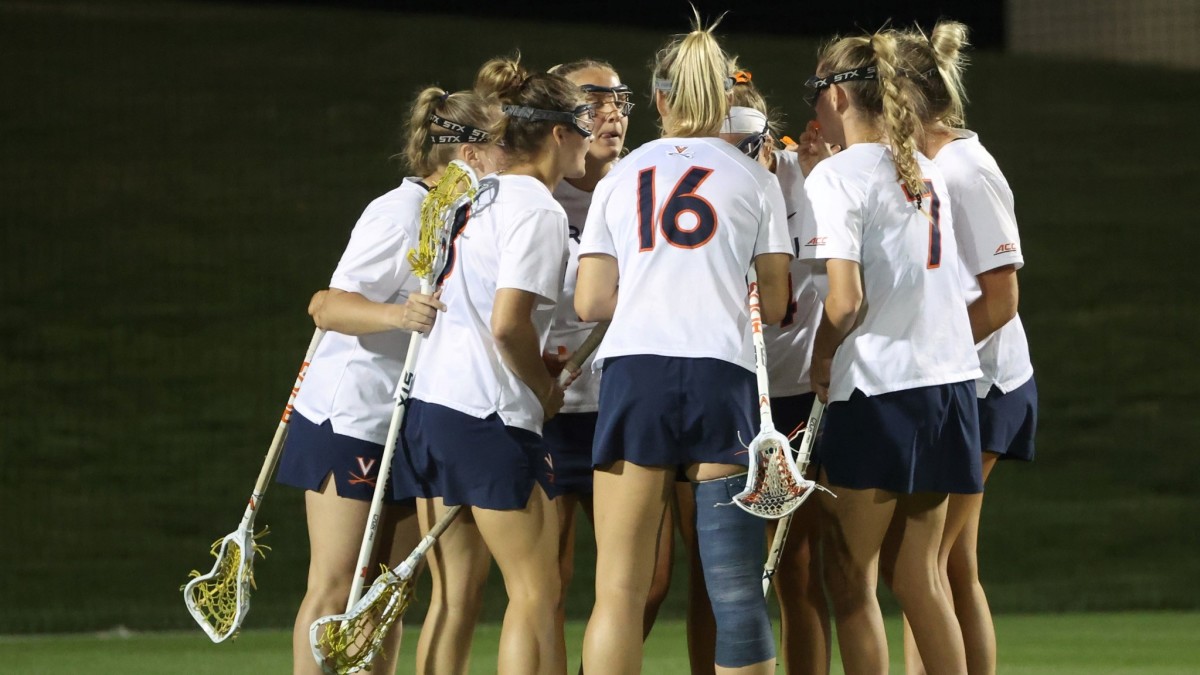 The Virginia women's lacrosse team huddles during a game against Virginia Tech at Klockner Stadium.