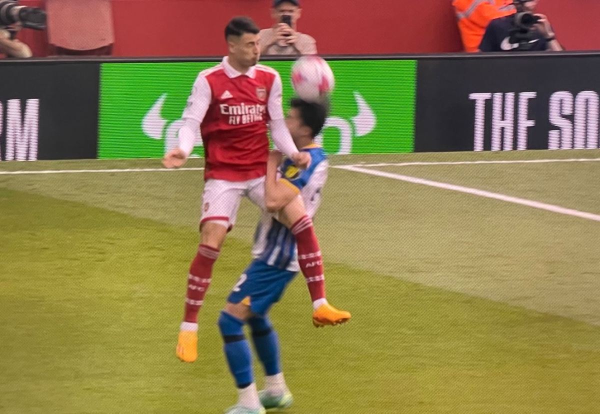 Arsenal winger Gabriel Martinelli pictured (left) fouling Brighton forward Kaoru Mitoma during a Premier League game in May 2023