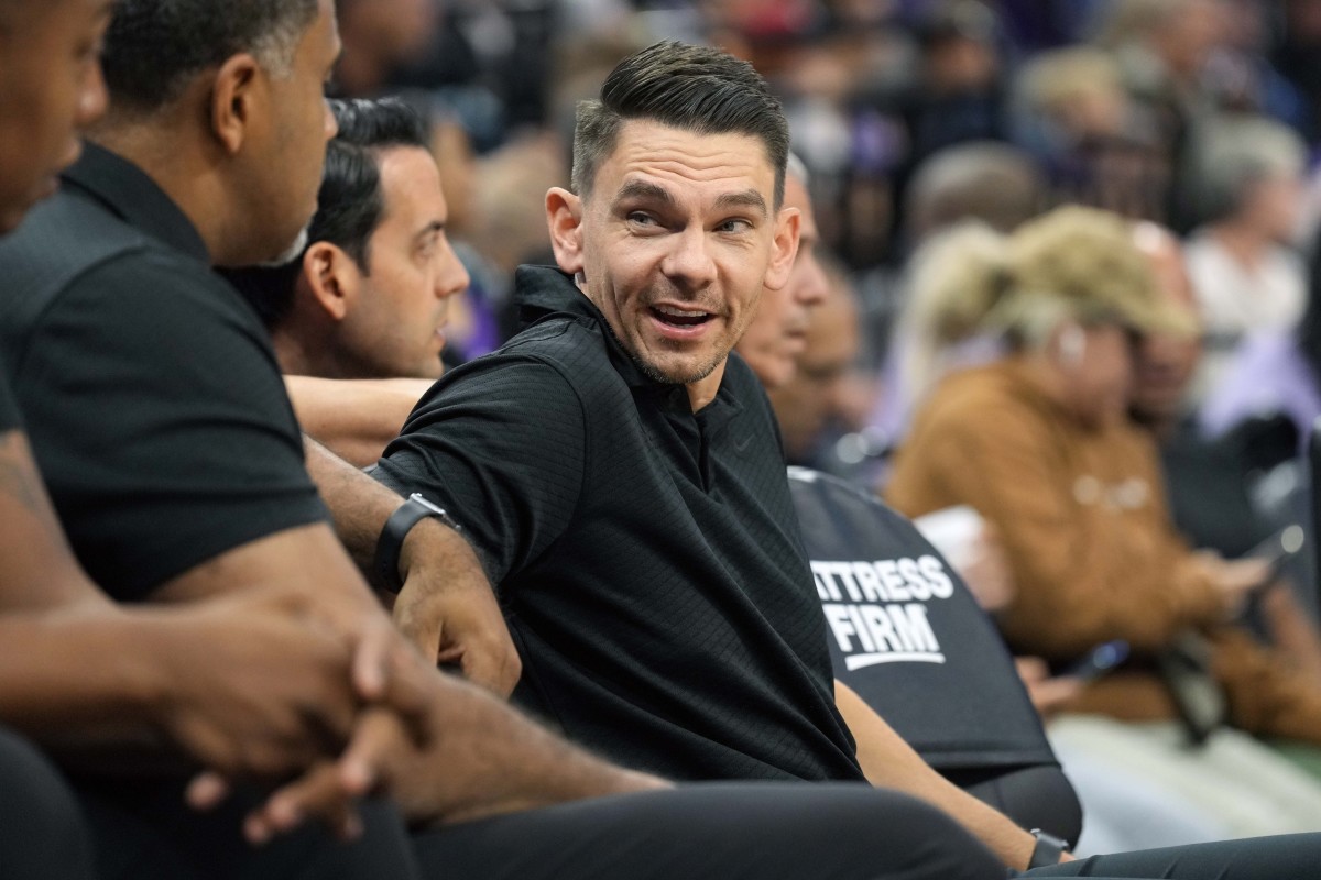 Miami Heat assistant coach Chris Quinn gestures during the first half of  the team's NBA basketball game against the Charlotte Hornets, Tuesday,  April 5, 2022, in Miami. Quinn was filling in for
