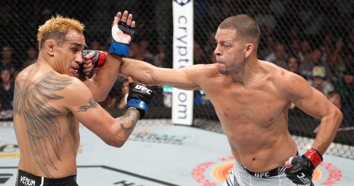 Nate Diaz connects with a punch on Tony Ferguson at UFC 279.