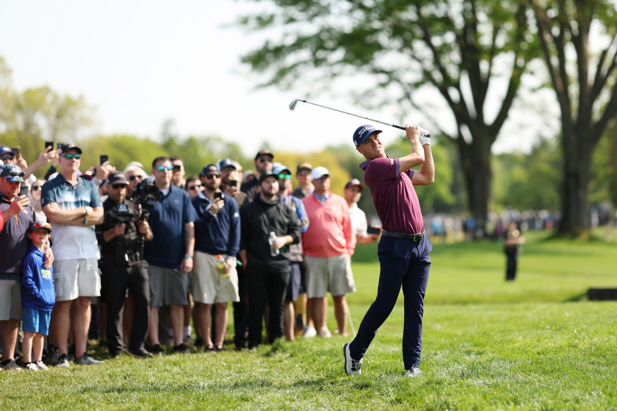 Justin Thomas of the United States plays a second shot on the sixth hole as fans look on during the final round of the 2023 PGA Championship at Oak Hill Country Club on May 21, 2023 in Rochester, New York.