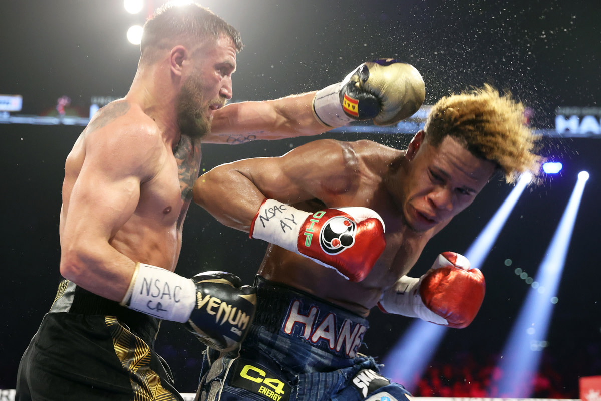 Vasiliy Lomachenko scores a punch on Devin Haney in their undisputed lightweight title fight in Las Vegas.