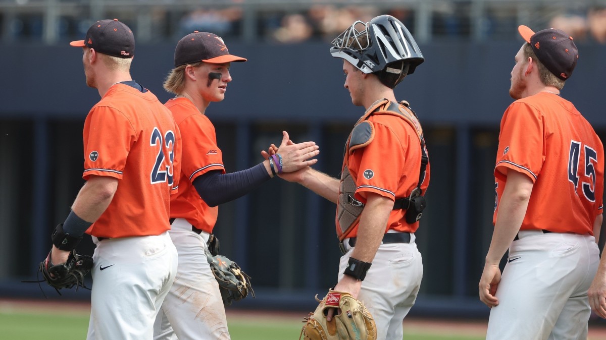 Griff O'Ferrall shakes hands with Kyle Teel after the Virginia baseball game against Louisville at Disharoon Park.