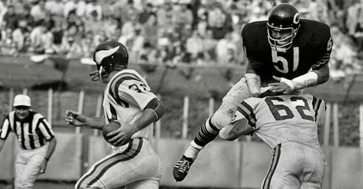 Ed White blocks Hall of Fame linebacker Dick Butkus