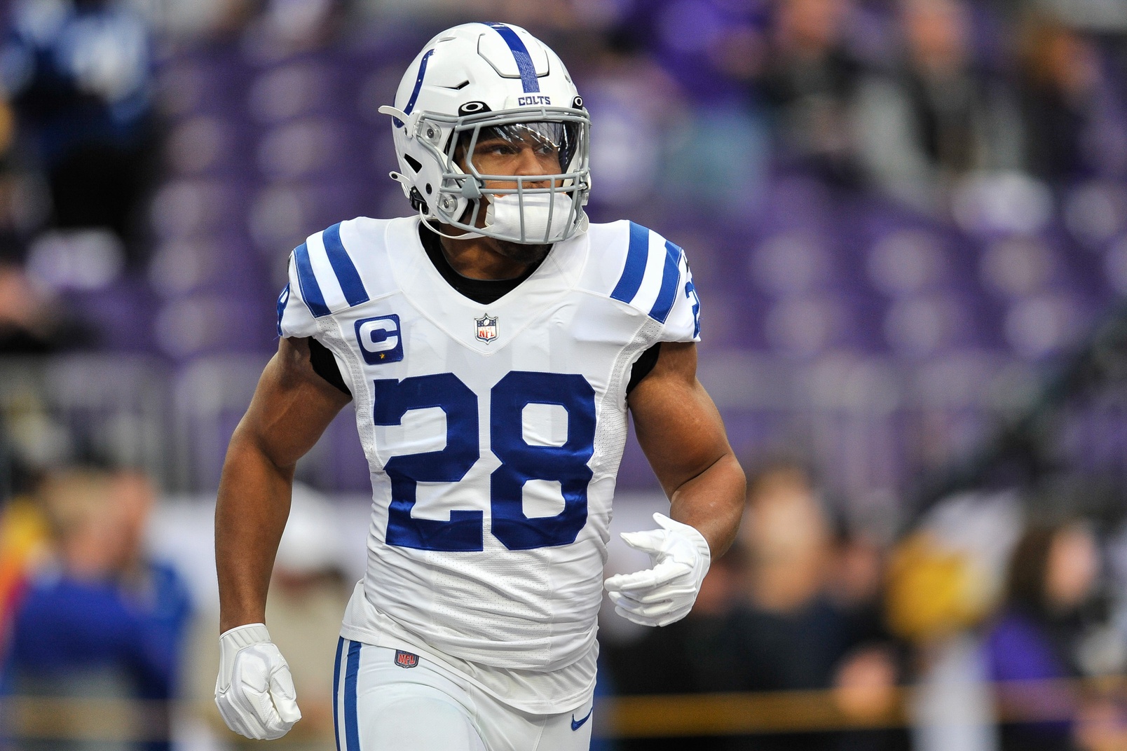 Indianapolis Colts running back Jonathan Taylor (28) runs with the ball  during the first half o …