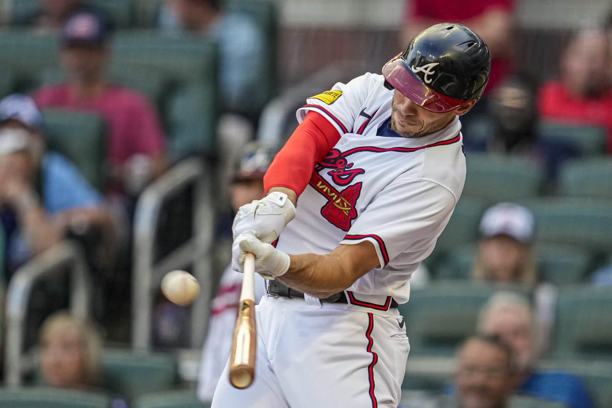 May 28, 2023; Cumberland, Georgia, USA; Atlanta Braves first baseman Matt Olson (28) hits a home run against the Philadelphia Phillies during the first inning at Truist Park.