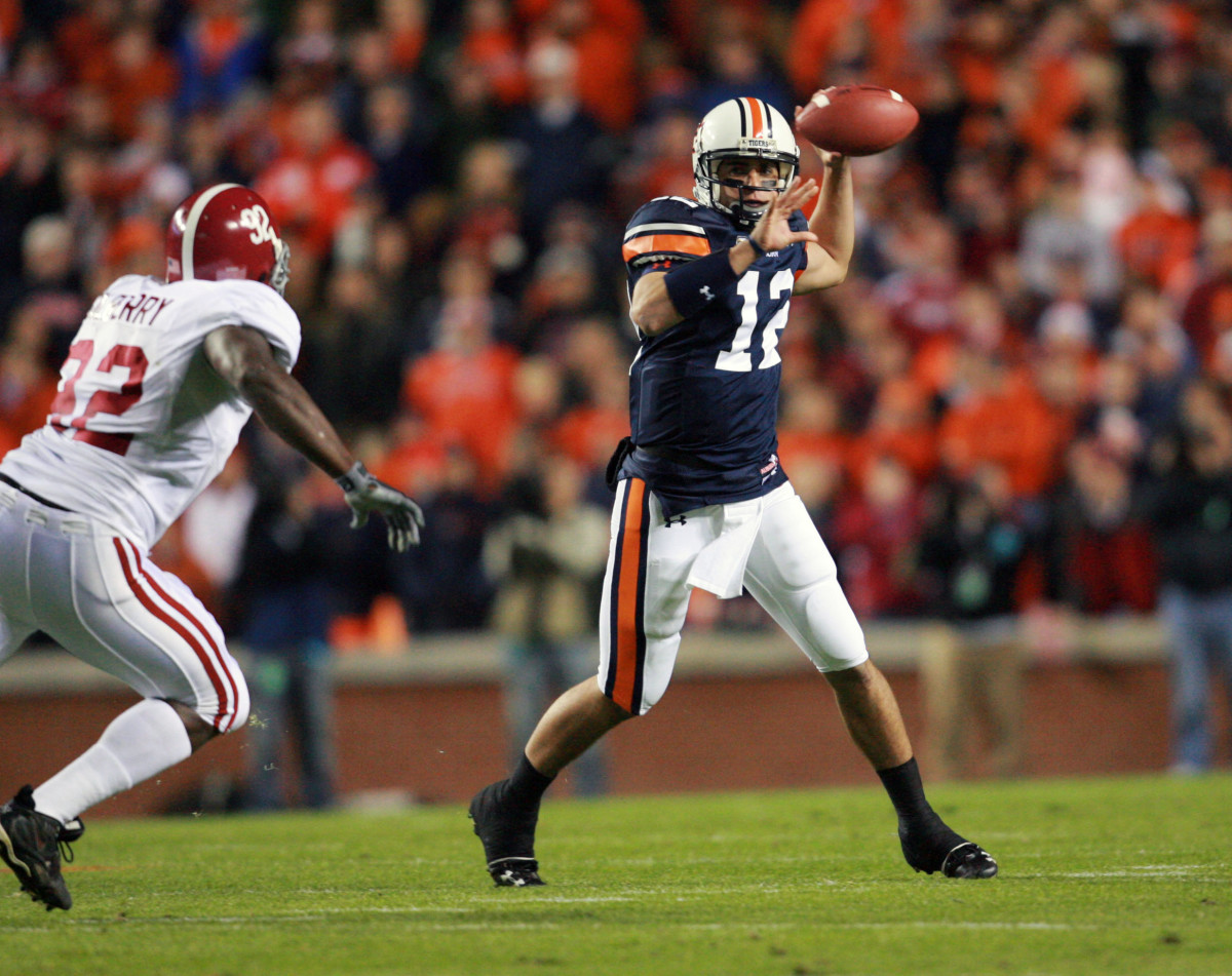 Nov 24, 2007; Auburn, AL, USA; Alabama Crimson Tide defensive lineman (92) Wallace Gilberry pursues Auburn Tigers quarterback (12) Brandon Cox at Jordan-Hare Stadium. Mandatory Credit: Photo by Marvin Gentry-USA TODAY Sports