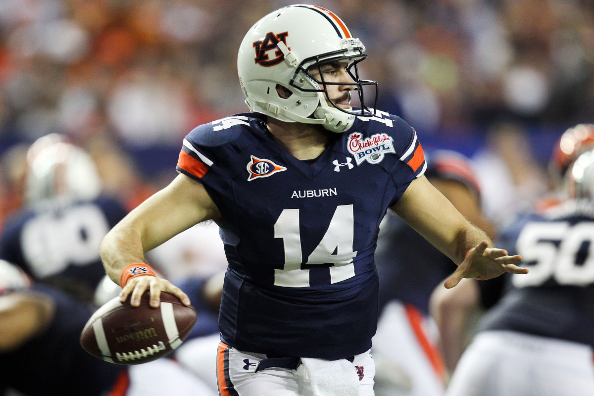 December 31, 2011; Atlanta, GA, USA; Auburn Tigers quarterback Barrett Trotter (14) drops back to pass the ball in the second half of the game against the Virginia Cavaliers at the Georgia Dome. Auburn beat Virginia 43-24. Mandatory Credit: Daniel Shirey-USA TODAY Sports