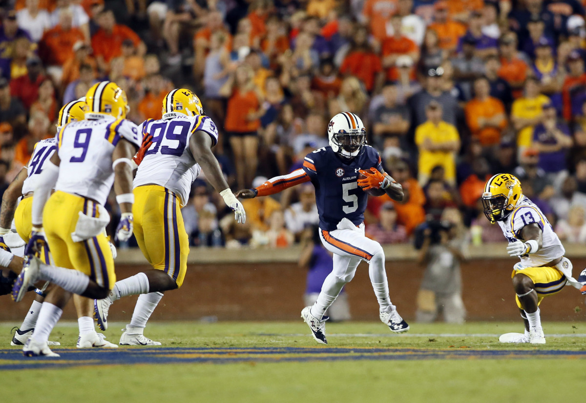 Sep 24, 2016; Auburn, AL, USA; Auburn Tigers quarterback John Franklin, III (5) carries against the LSU Tigers during the fourth quarter at Jordan Hare Stadium. The Auburn Tigers beat the LSU Tigers 18-13. Mandatory Credit: John Reed-USA TODAY Sports