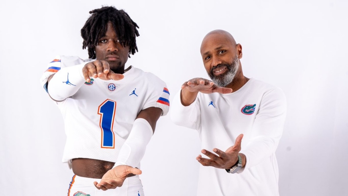 Florida Gators cornerback target Zavier Mincey with secondary coach Corey Raymond.