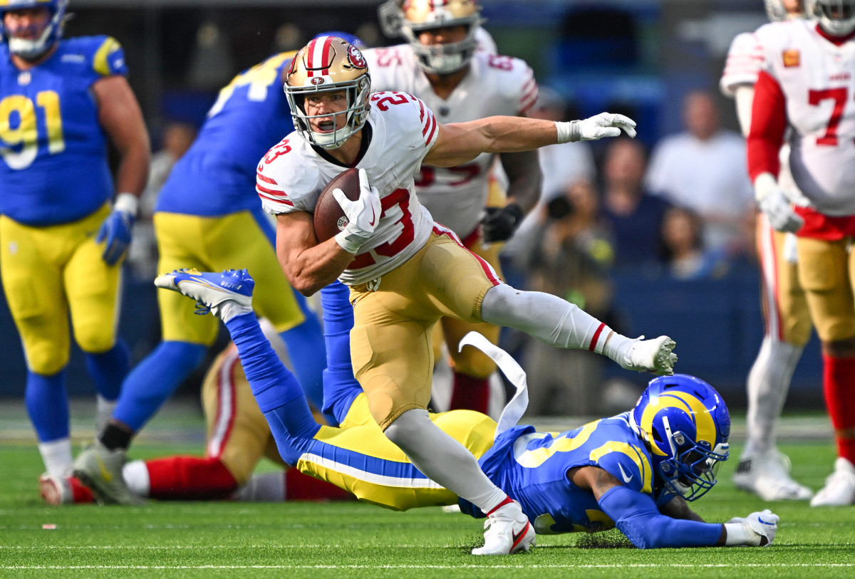 Christian McCaffrey evading Rams tacklers as a member of the 49ers