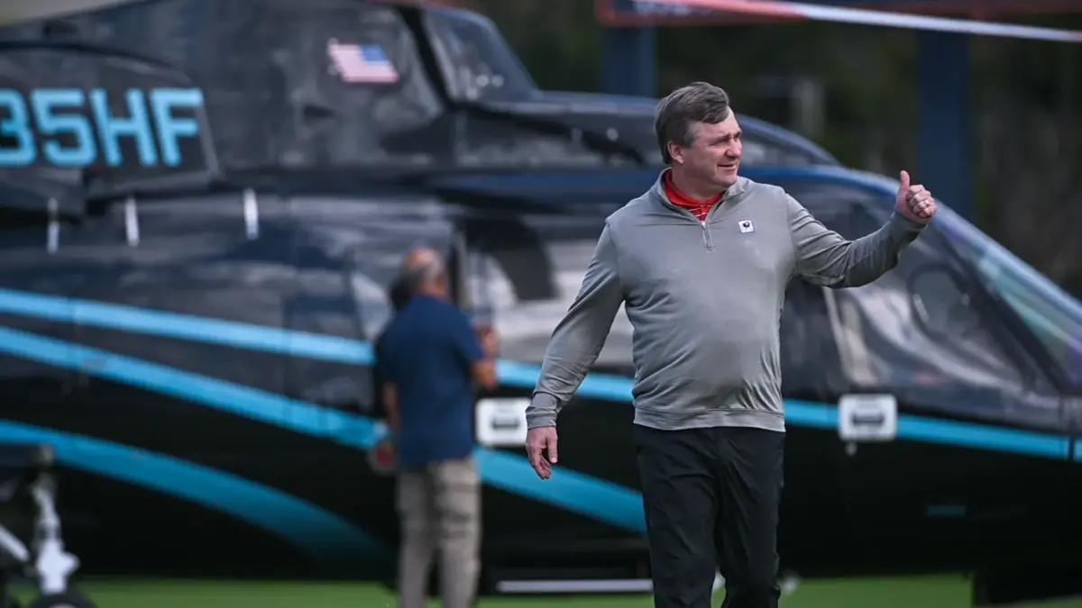 University of Georgia Football Head Coach Kirby Smart waves to students gathered at Benjamin High School to greet him during a recruiting visit on Wednesday, January 25, 2023, in Palm Beach Gardens, FL.