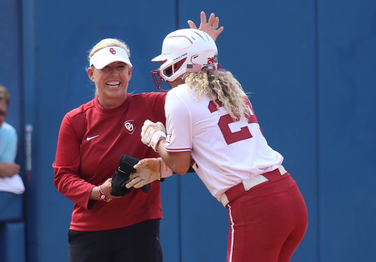 Patty Gasso celebrates Jayda Coleman's game-winning hit against Stanford.