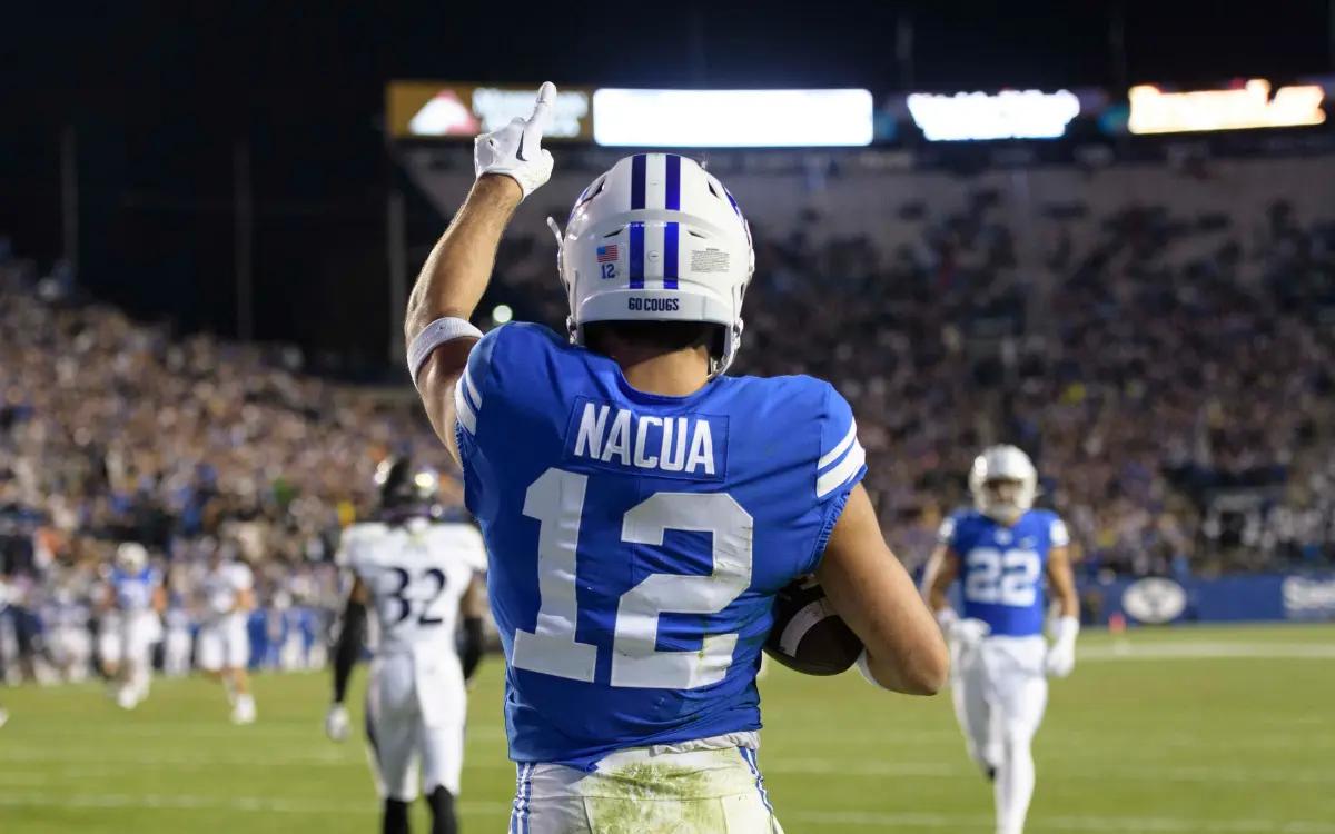 Los Angeles Rams receiver Puka Nacua celebrates a touchdown during his college days at BYU.