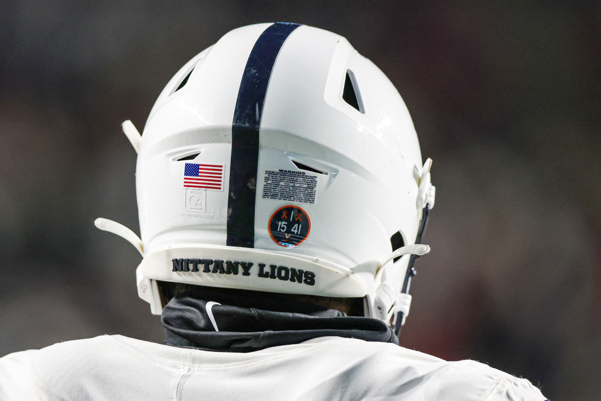 Nov 19, 2022; Piscataway, New Jersey, USA; A Penn State Nittany Lions helmet is seen with a sticker honoring the Virginia football players who were victims of a shooting on the University of Virginia campus, on November thirteenth 2022, during the second half against the Rutgers Scarlet Knights at SHI Stadium. Mandatory Credit: Vincent Carchietta-USA TODAY Sports