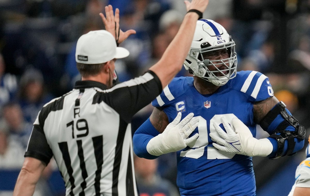 Indianapolis Colts defensive tackle DeForest Buckner (99) brushes off his chest after sacking Los Angeles Chargers quarterback Justin Herbert (10) on Monday, Dec. 26, 2022, during a game against the Los Angeles Chargers at Lucas Oil Stadium in Indianapolis.