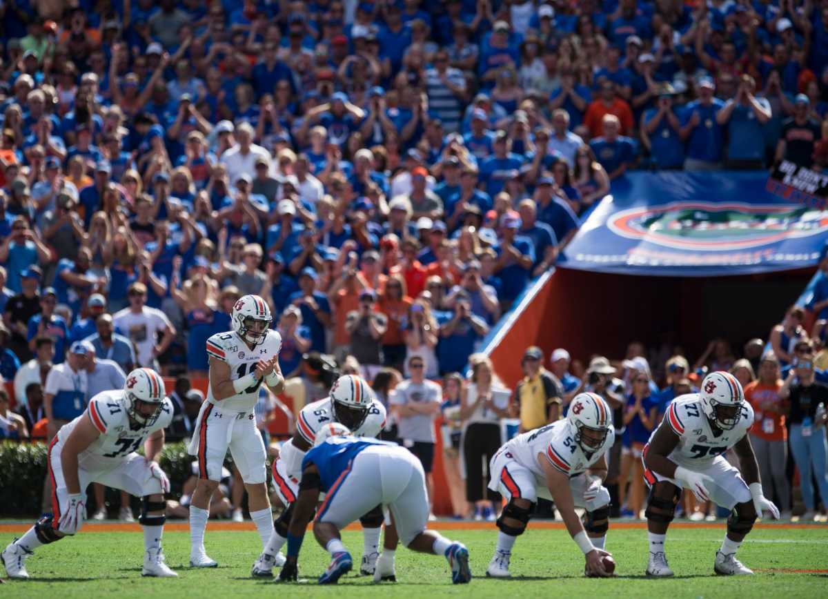 Auburn quarterback Bo Nix (10) lines up to snap the ball from center Kaleb Kim (54) at Ben Hill Griffin Stadium in Gainesville, Fla., on Saturday, Oct. 5, 2019. Florida defeated Auburn 24-13. Jc Auburnflorida 94