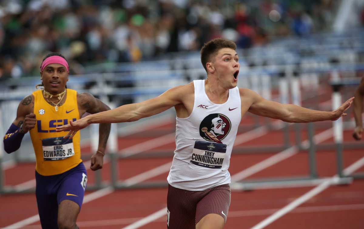 Florida State's Trey Cunningham, right, celebrates his victory in the men's 110 hurdles at the NCAA Outdoor Track & Field Championships.