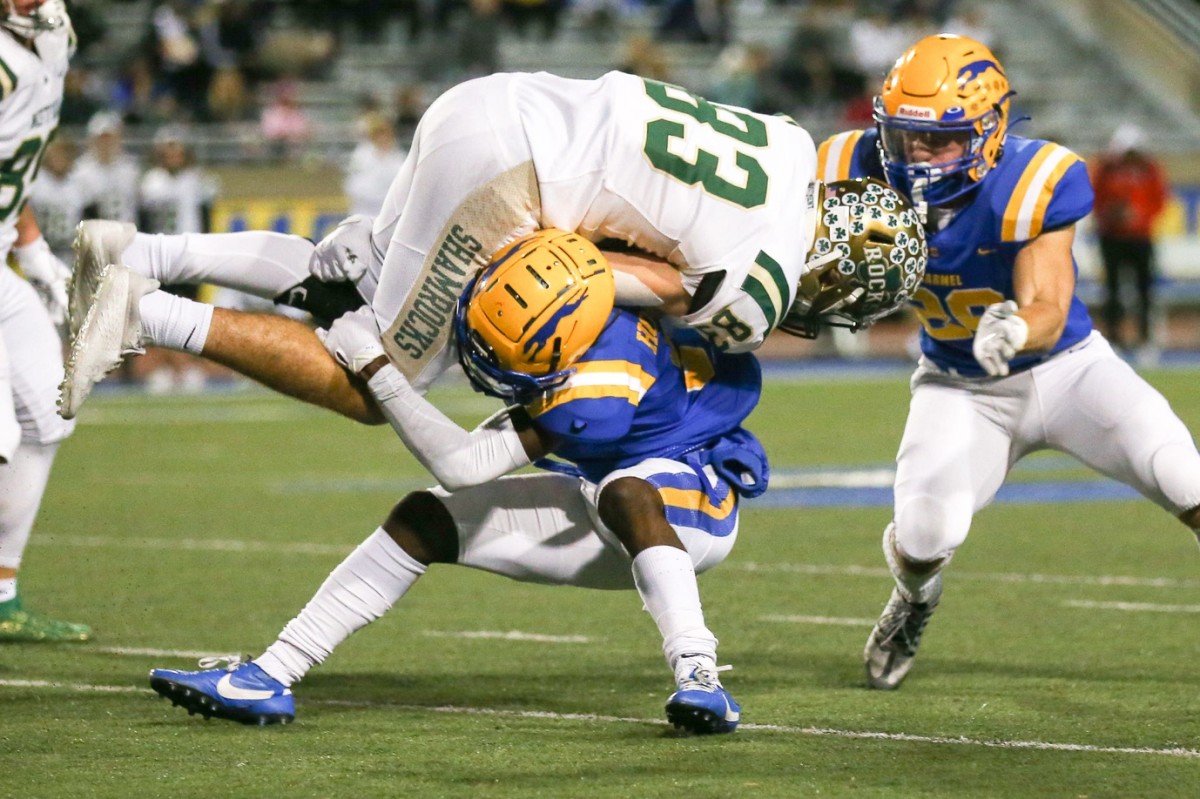 Westfield Maximus Nosler (83) runs out of room with the stop from Carmel Christian Peterson (3) and Carmel Kyle Fedorcha (26) during Carmel vs. Westfield IHSAA Football Class 6A, Sectional 4, Semi-final, Oct 28, 2022