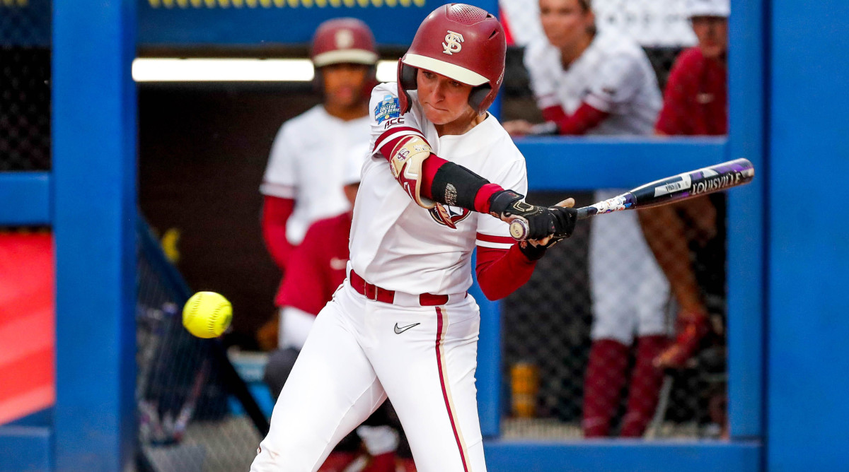 Florida State outfielder Kaley Mudge hits in the first inning during the first game of the Women's College World Series finals.