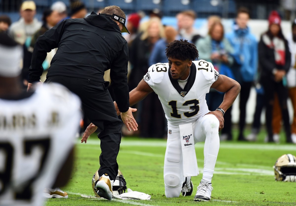 New Orleans Saints wide receiver Michael Thomas (13) and New Orleans Saints head coach Sean Payton slap hands before the game against the Tennessee Titans at Nissan Stadium.