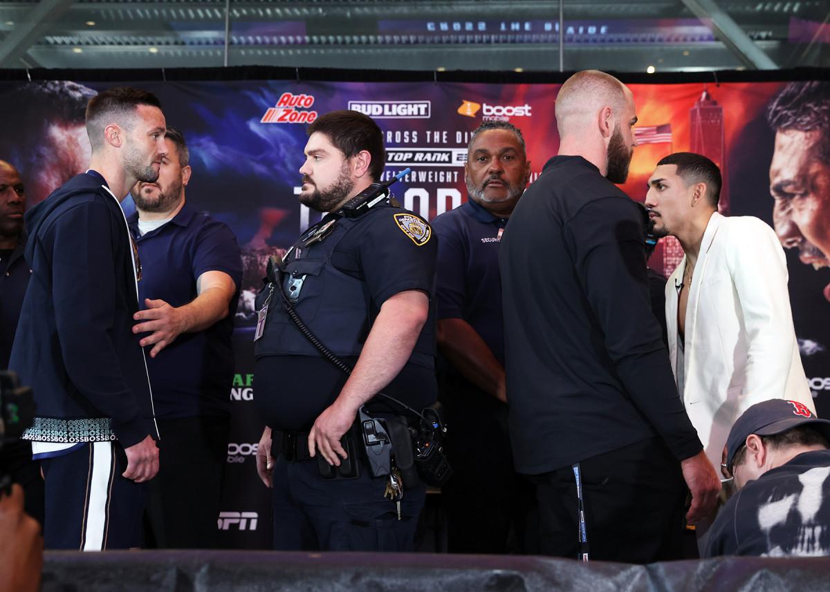 Josh Taylor and Teofimo Lopez have to be separated during their pre-fight press conference.
