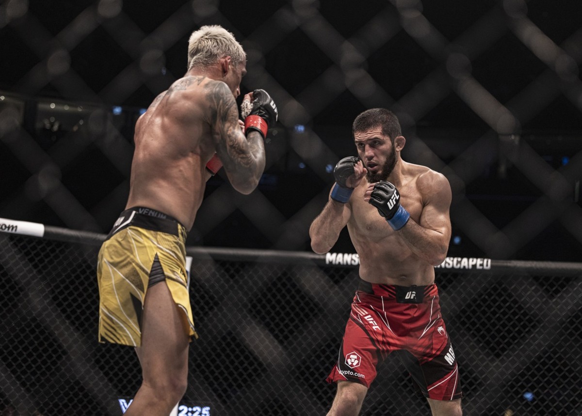 Islam Makhachev and Charles Oliveira inside the Octagon for their UFC Lightweight Championship fight.