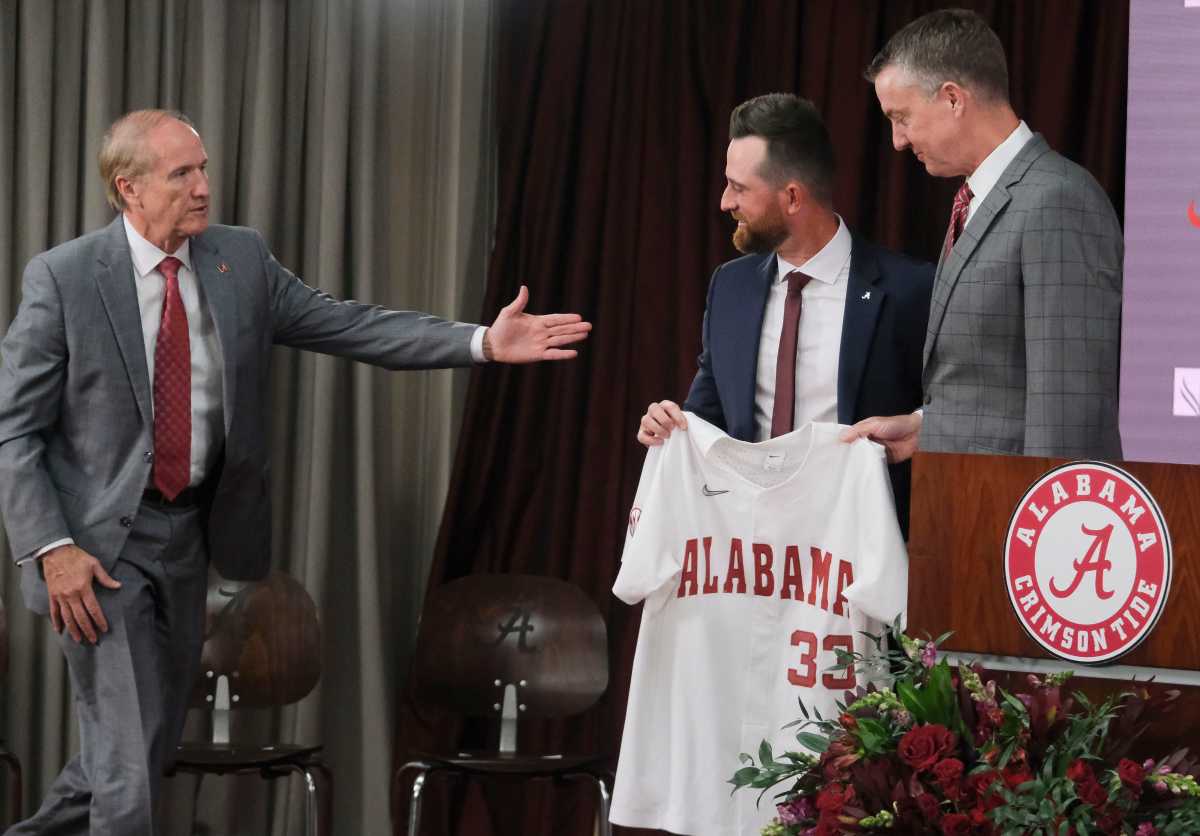 The University of Alabama introduced Rob Vaughn as the new head baseball coach Tuesday, June 13, 2023. University of Alabama President Stuart Bell and Athletic Director Greg Byrne pose for a photo with Vaughn.